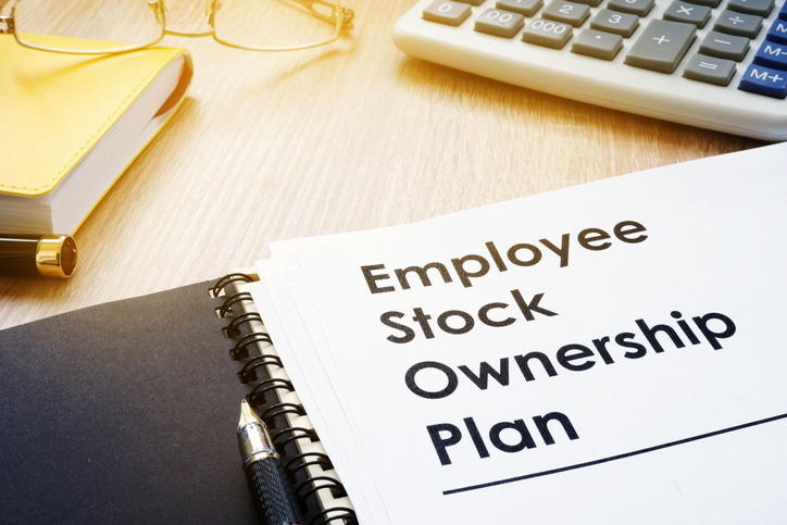Employee Stock Ownership Plan paperwork on a desk